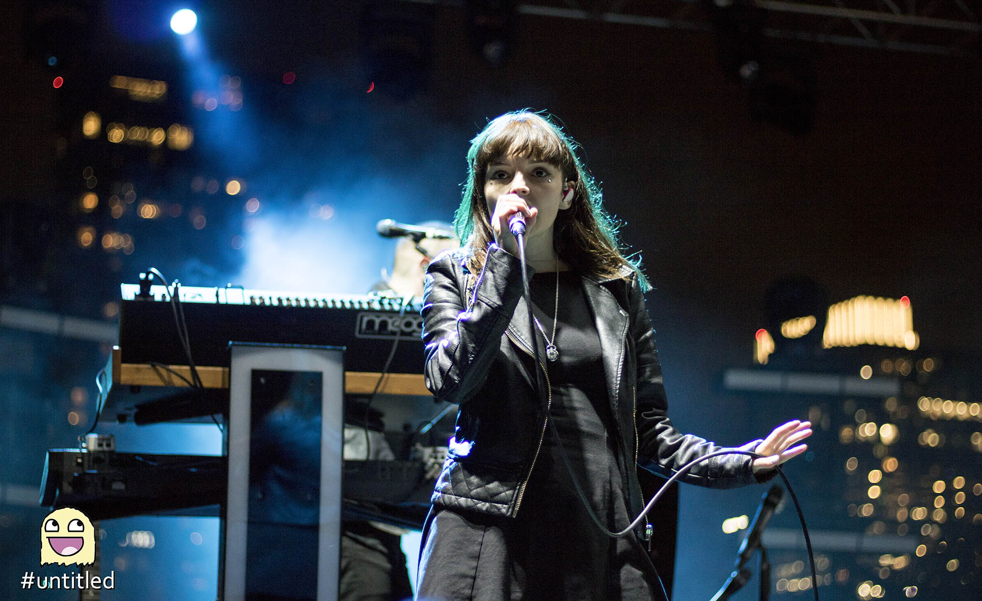 Chvrches Holding Microphone
